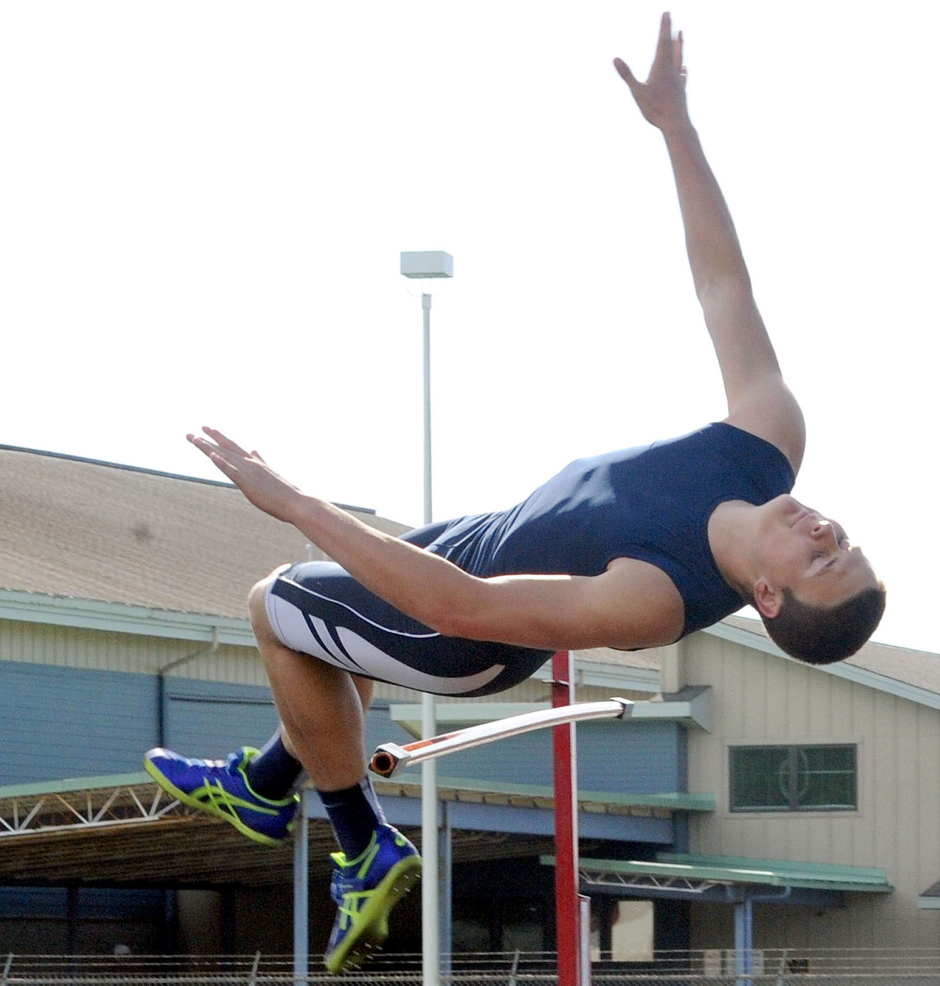 Forks' Cole Baysinger hit the bar on this high jump attempt but came back to set a personal record of 6 feet and win the event during a meet with Tenino and Elma. (Lonnie Archibald/for Peninsula Daily News)