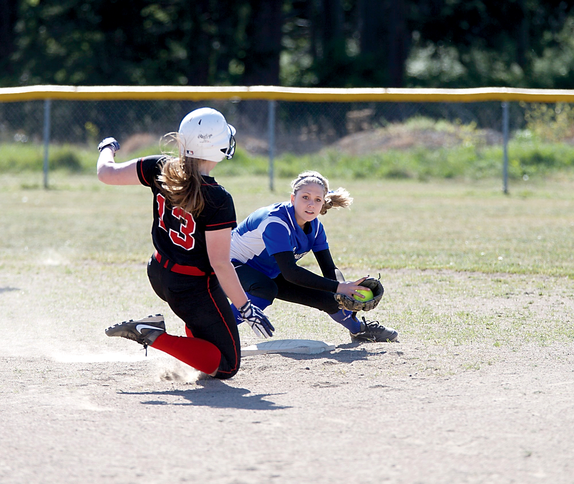 Chimacum second baseman Bradyn Nelson gets ready to tag out Port Townsend's Bali Shaw. (Steve Mullensky/for Peninsula Daily News)