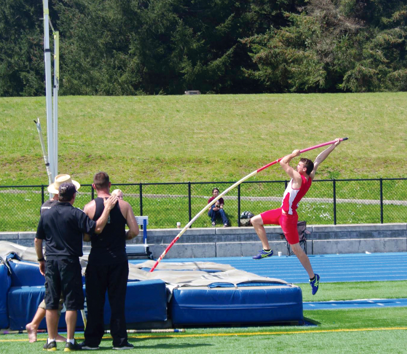 Jayson Brocklesby takes off on his personal-record setting pole vault of 12 feet