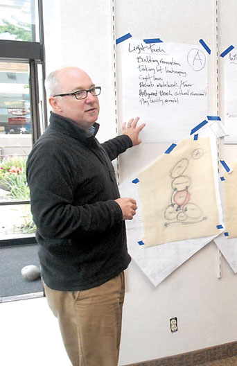 Bill Grimes of the Studio Cascade design group explains the proposals. (Keith Thorpe/Peninsula Daily News)