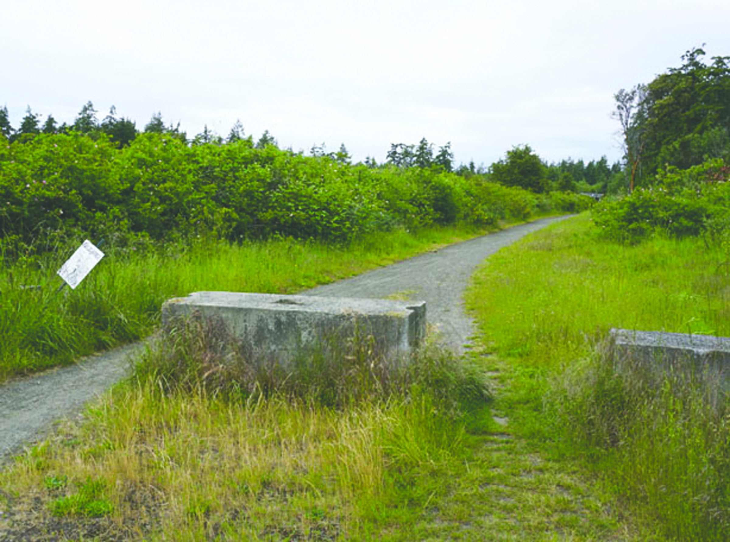 This path will become a road leading to a roundabout on Discovery Road in Port Townsend after its expected completion next spring. (Charlie Bermant/Peninsula Daily News)