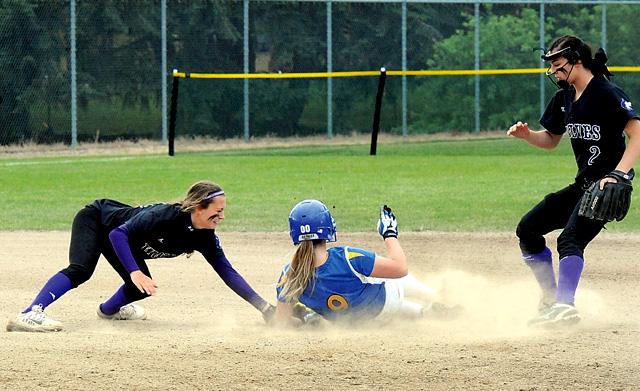 Sequim's Bobbi Sparks attempts to tag Fife's Maggie Crist at second base during the District 2/3 tournament at Sprinker Fields last week. Sequim's Jordan Bentz