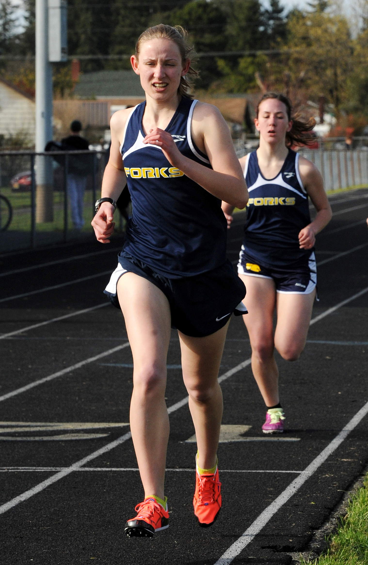 Forks senior Kari Larson will compete in her final state track and field championship this weekend. She'll also sing the national anthem before Saturday's opening ceremonies. (Lonnie Archibald/for Peninsula Daily News)