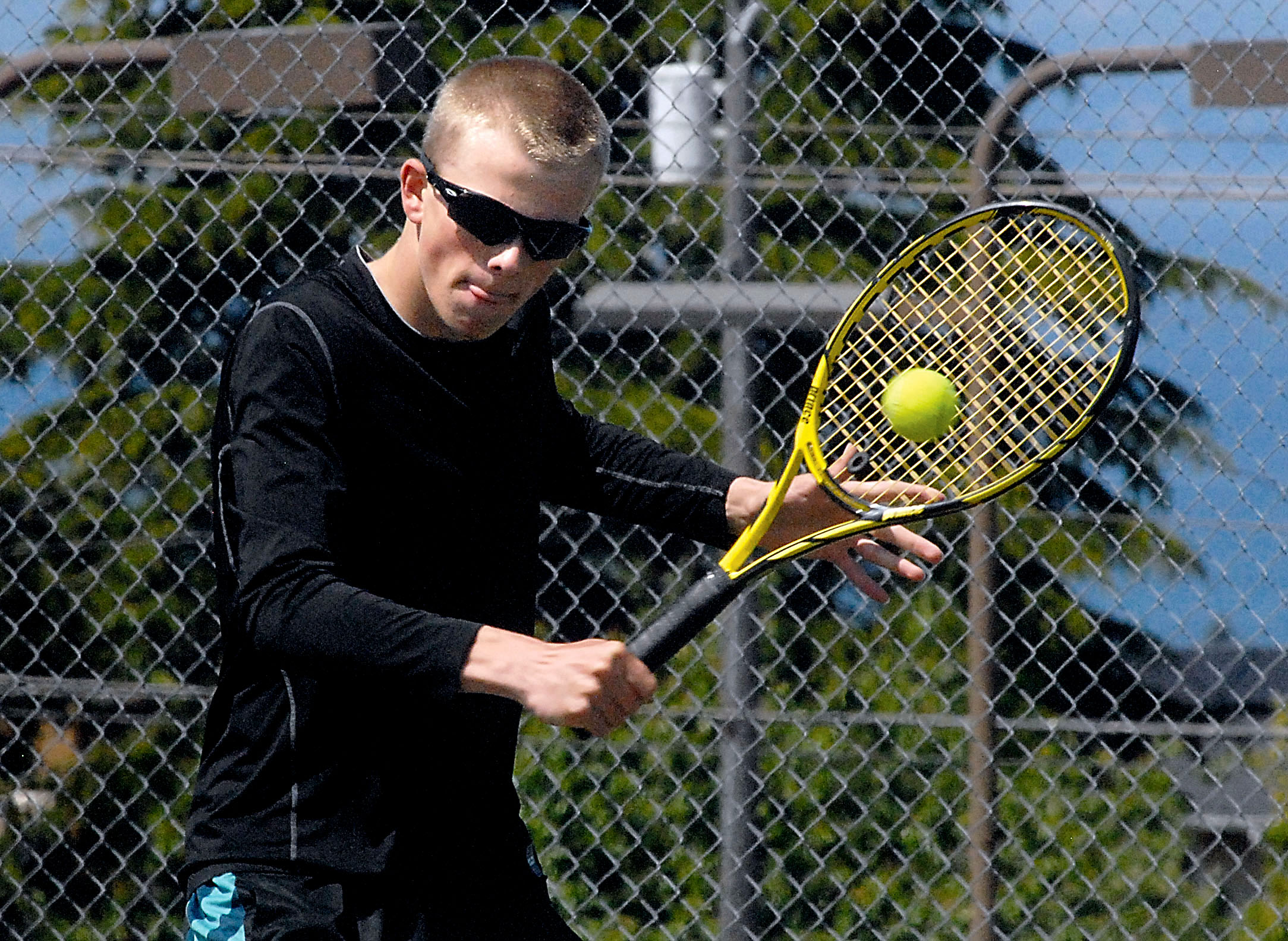 Port Angeles' Janson Pederson practices at the high school's tennis courts earlier this week in preparation for state competition. (Keith Thorpe/Peninsula Daily News)