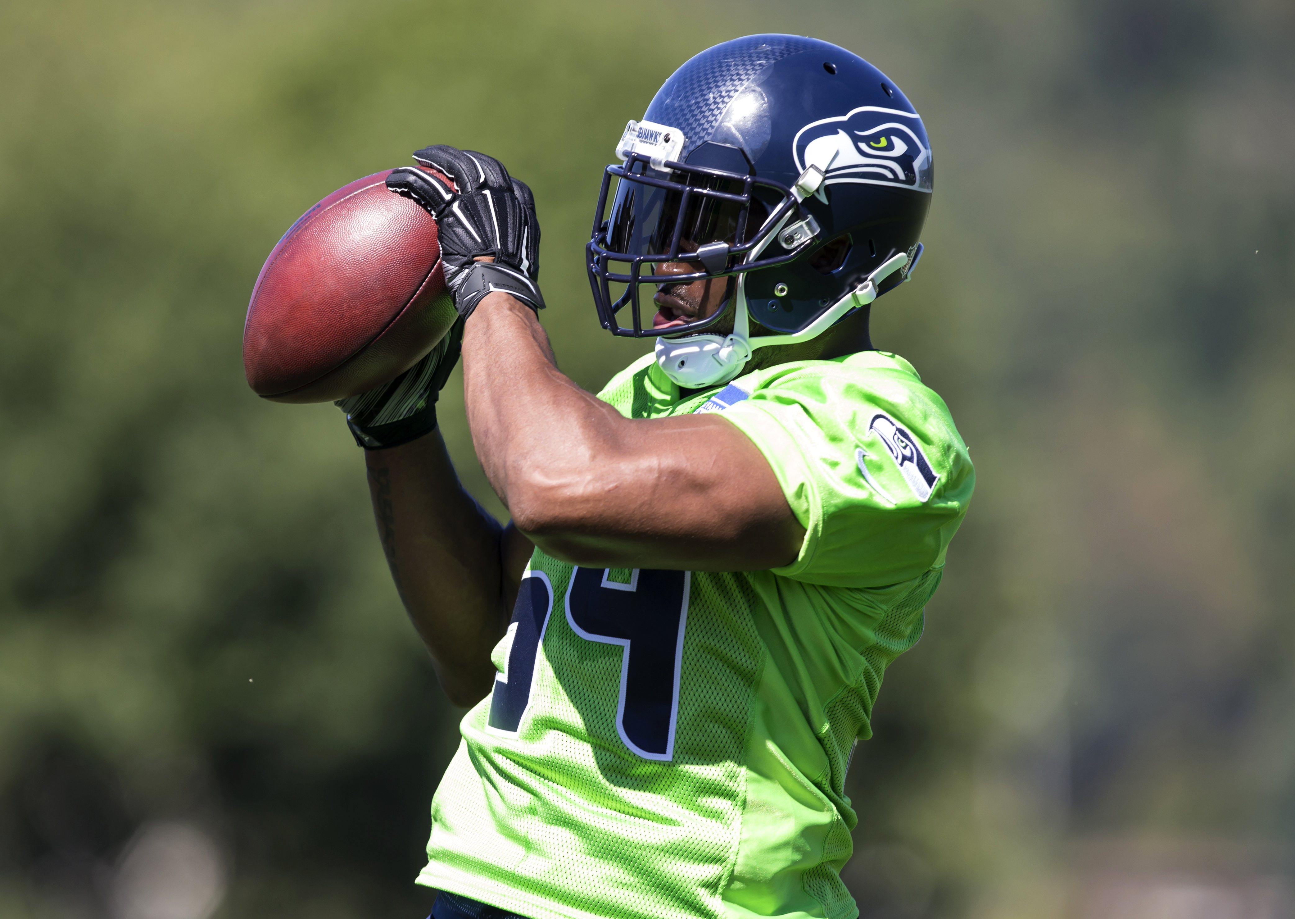 Seattle Seahawks linebacker Bobby Wagner catches a ball in drills during training camp Friday in Renton. Stephen Brashear/The Associated Press