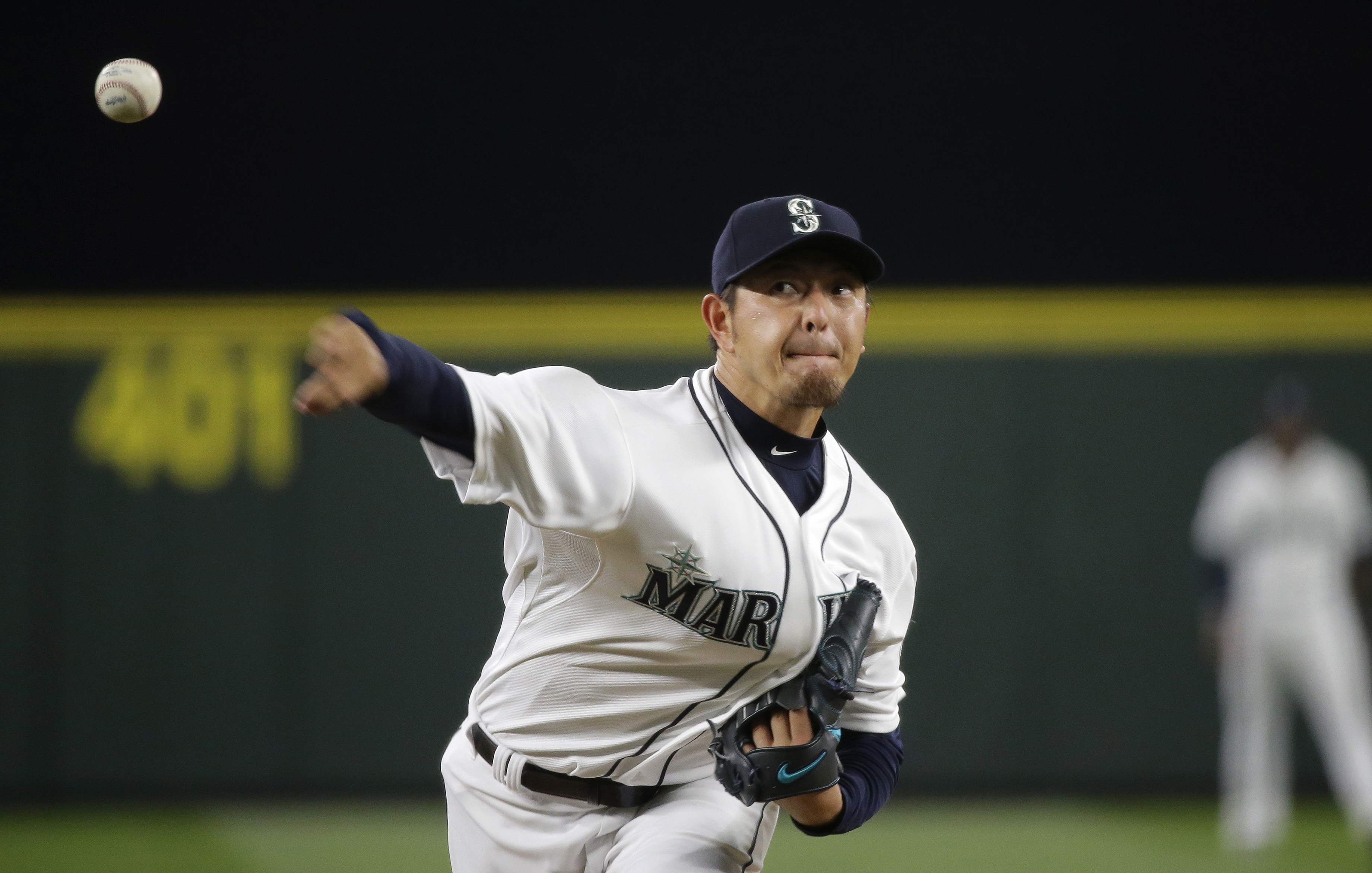 Baseball player Hisashi Iwakuma pitches