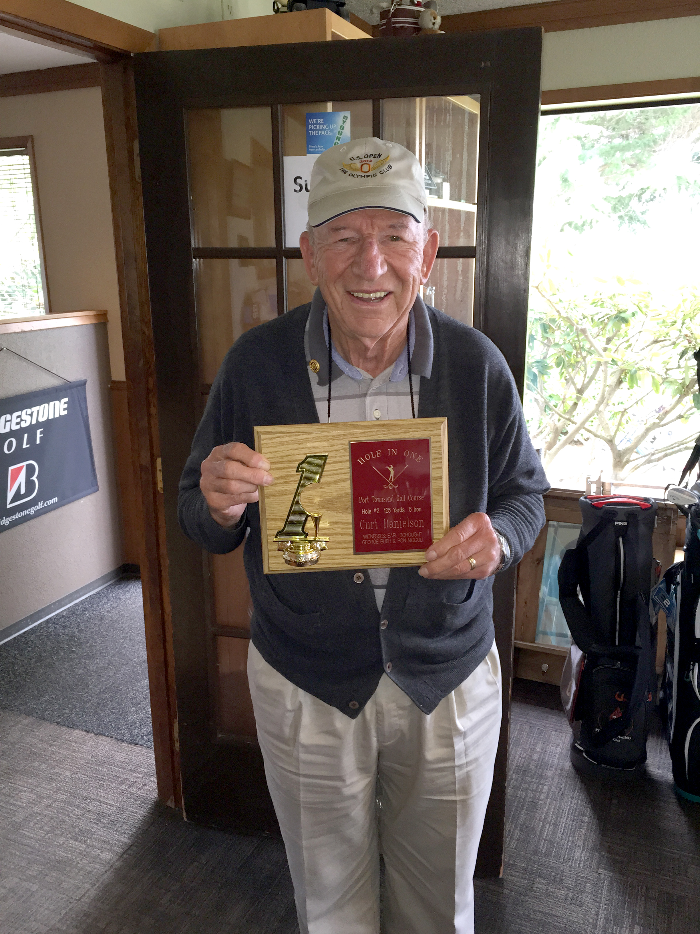 Curt Danielson holds a plaque he received after shooting his first hole-in-one in more than 60 years of golf. Port Townsend Golf Club