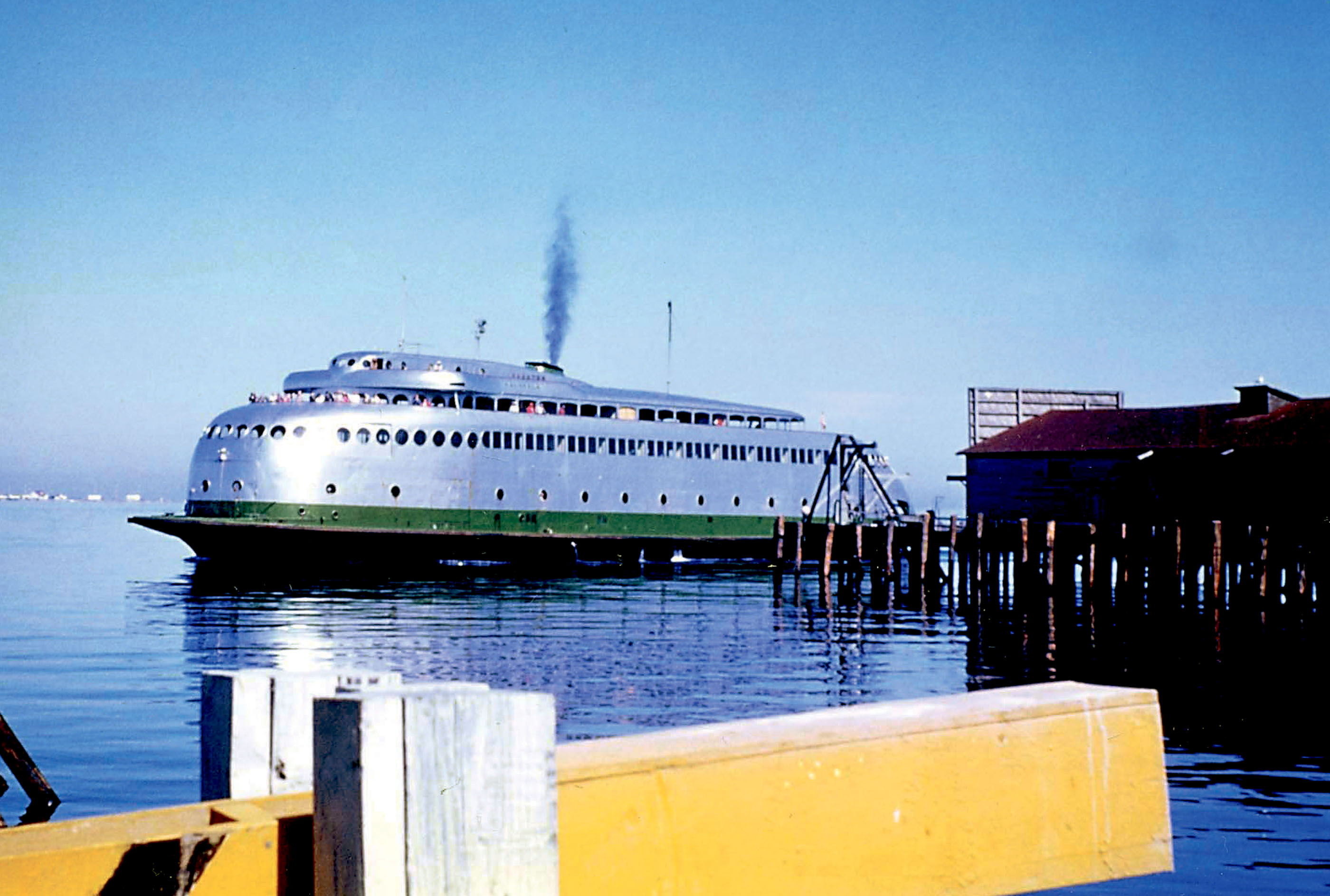 The MV Kalakala pulls into its landing on Port Angeles Harbor during its Port Angeles-Victoria service during the 1950s. (Peninsula Daily News collection)