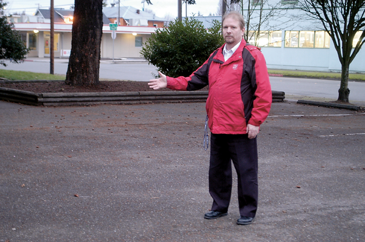 Major John Tumey of the Port Angeles Salvation Army stands in a now empty parking lot where a group of squatters were recently cleared. (Chris McDaniel/Peninsula Daily News)
