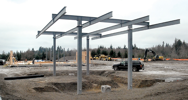 The framework for a new convenience store and fuel station being built by the Lower Elwha Klallam tribe is going up at U.S. Highway 101 at Dry Creek Road west of Port Angeles. (Keith Thorpe/Peninsula Daily News)
