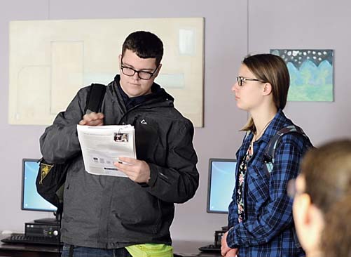 Sequim High students Taylor Bullock and Emily Webb present information about the Sequim School District’s $54 million construction bond proposal to classmates in early January. — Michael Dashiell/Olympic Peninsula News Group ()