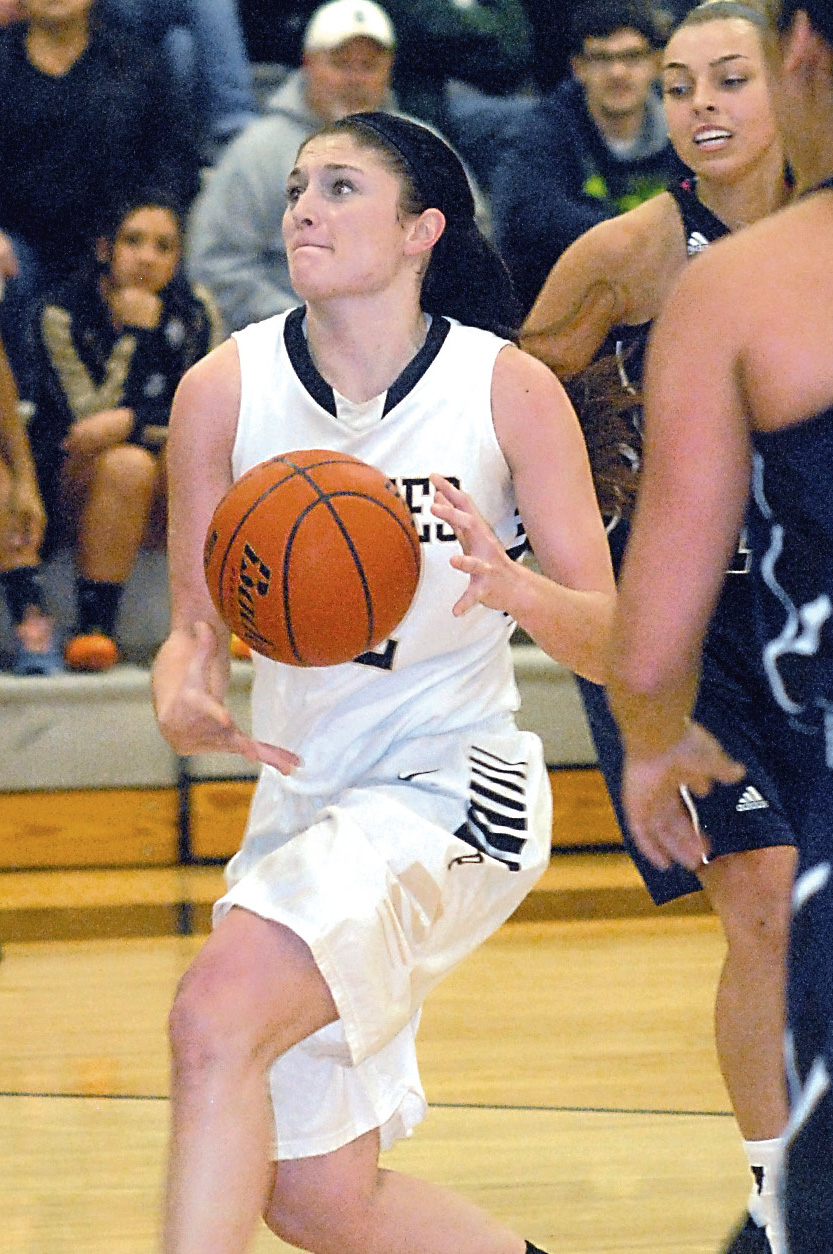 Peninsula's Madison Pilster drives to the lane in a game against Whatcom last week in Port Angeles. Pilster scored a career-high 30 points in a 79-58 win. (Keith Thorpe/Peninsula Daily News)