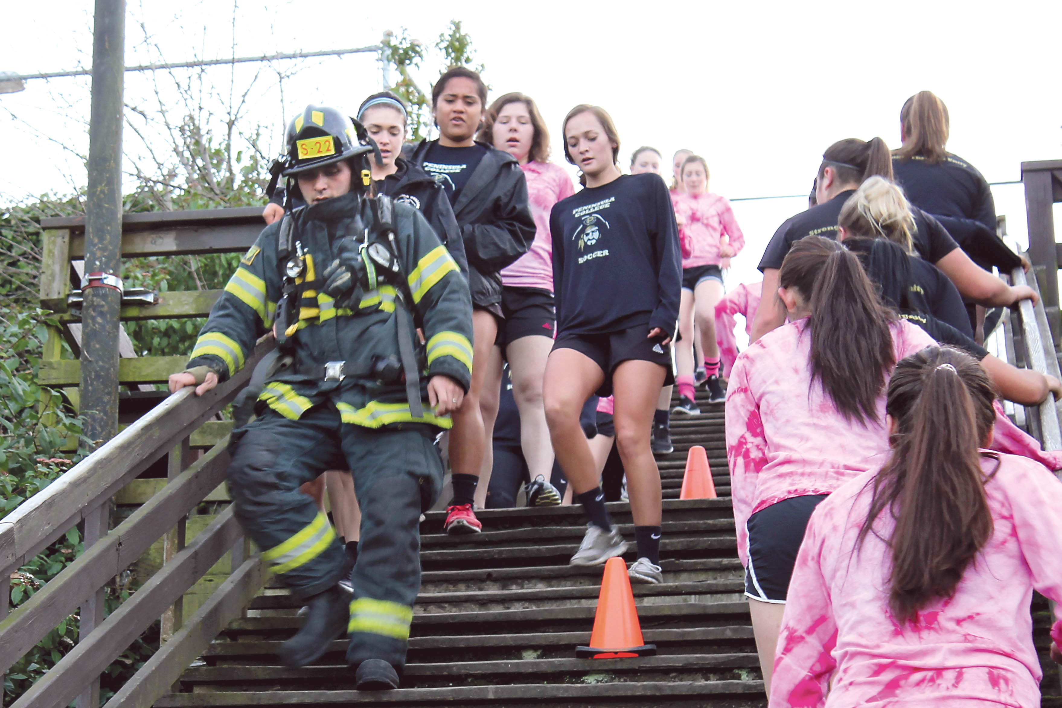 Area students work out with Port Angeles firefighters Feb. 16 at the staircase behind the Conrad Dyar Memorial Fountain at First and Laurel streets in Port Angeles. — Rob Edwards ()