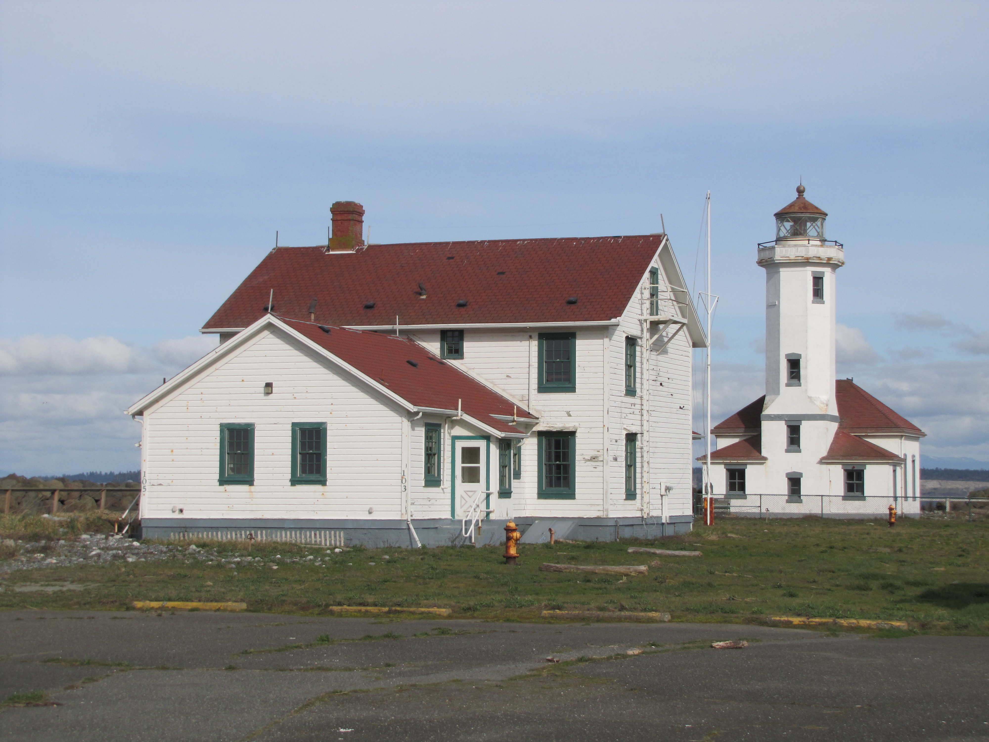 The U.S. Coast Guard is seeking bids for the operation and maintenance of the Point Wilson Lighthouse at Fort Worden. The lighthouse and associated buildings would be be leased to an organization that can maintain the property in a historical context. (Arwyn Rice/Peninsula Daily News)