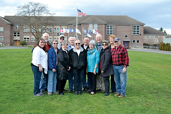 Board members and volunteers for the Sequim Museum are in the back