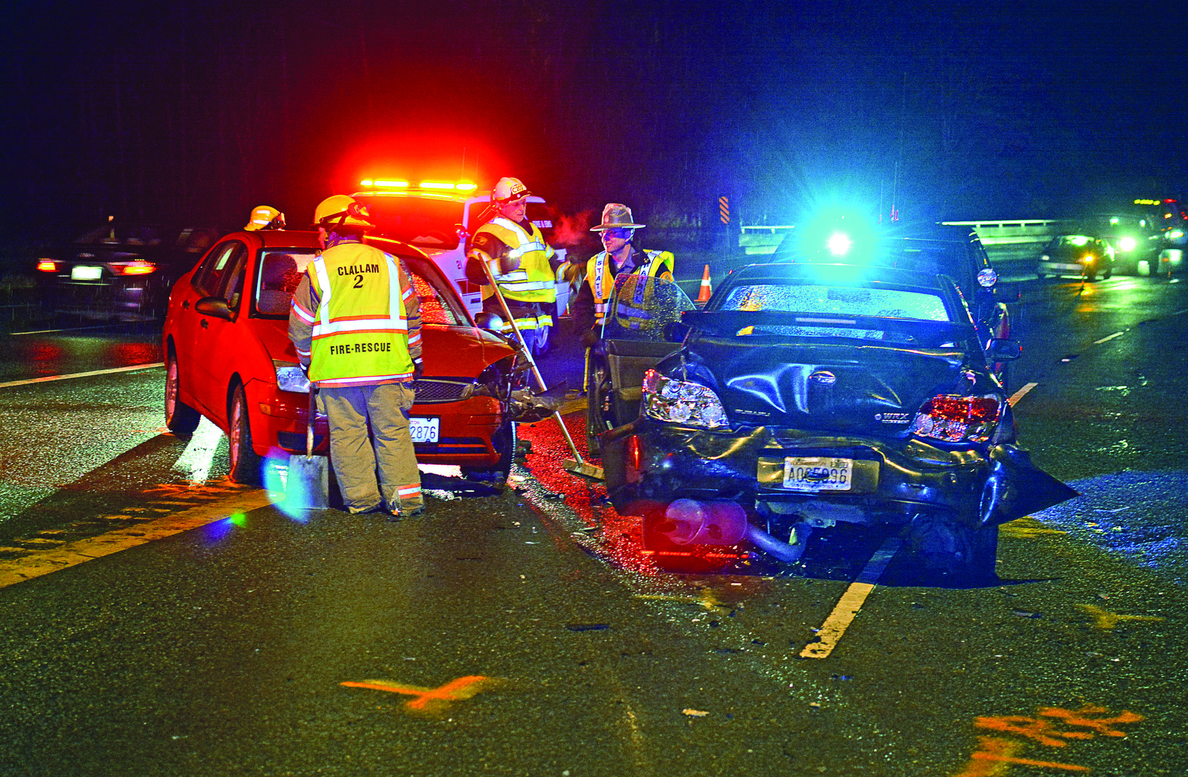 This wreck on U.S. Highway 101 east of Port Angeles on Sunday night sent two people to the hospital. — Jay Cline/Clallam County Fire District No. 2 ()