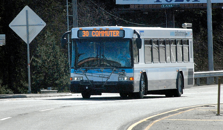 A Clallam Transit bus on the Route 30 commuter run between Port Angeles and Sequim makes its way along U.S. Highway 101 near Deer Park Road on Thursday. (Keith Thorpe/Peninsula Daily News)
