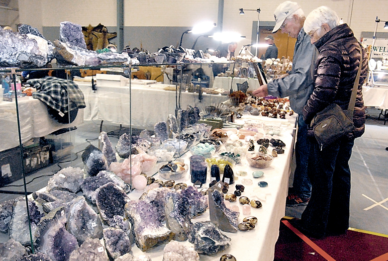 Reno and Cheryl Vaillancourt of Sequim look over a table filled with rocks and minerals at the fifth annual Rock