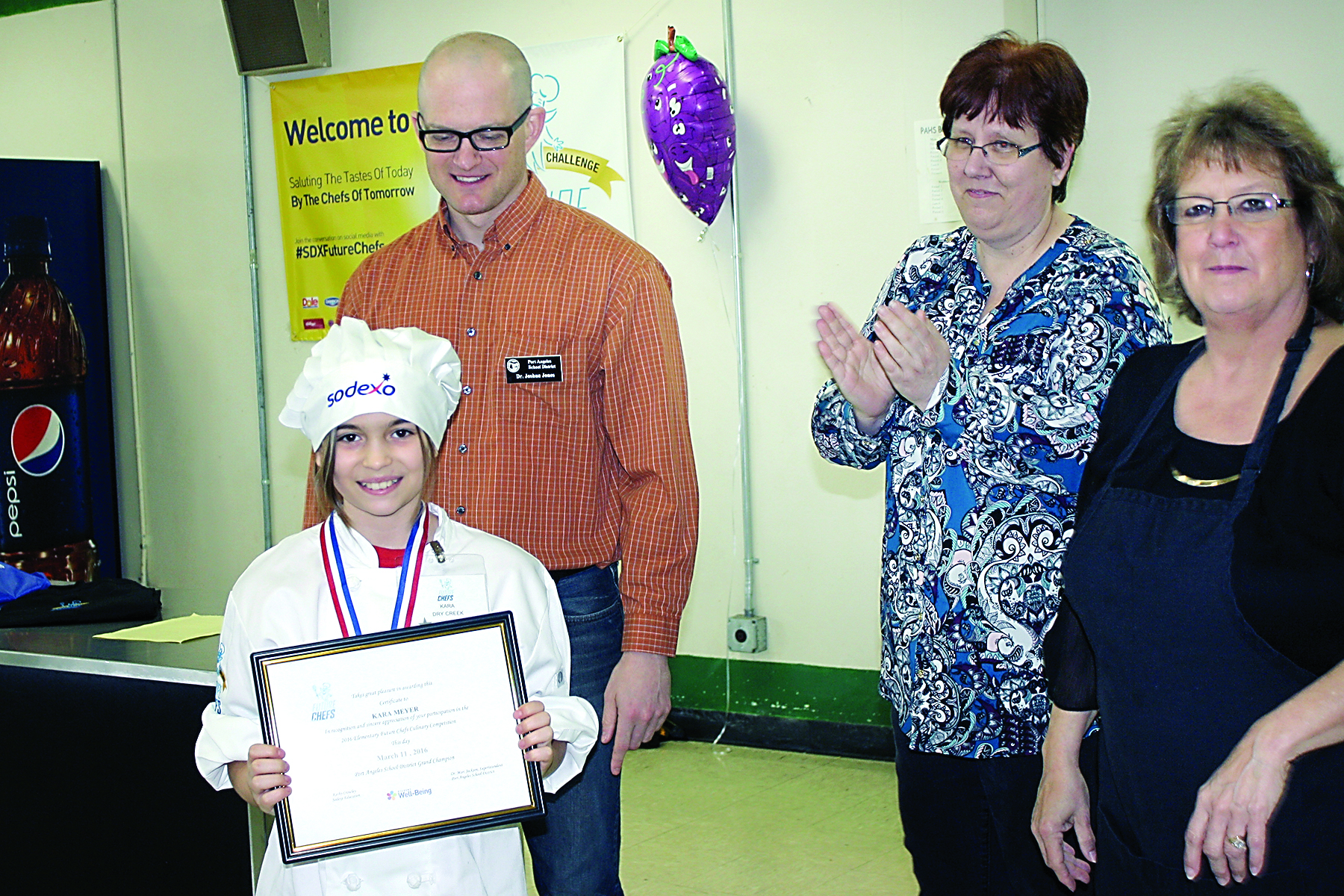 Overall Grand Champion Kara Meyer holds her certificate after winning the 2016 Future Chefs Challenge. Behind her