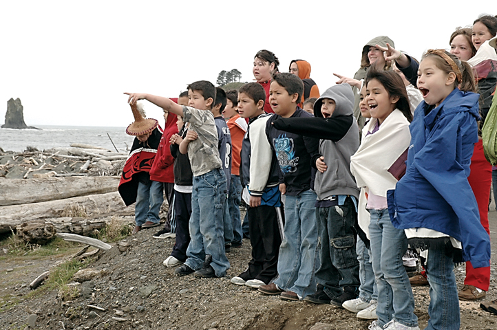 Quileute children point at whales that arrived during the 2009 whale welcoming ceremony. (Chris Cook)
