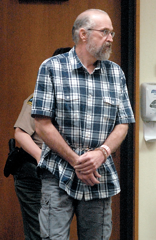 Douglas Allison enters Clallam County Superior Court in Port Angeles on Wednesday. (Keith Thorpe/Peninsula Daily News)