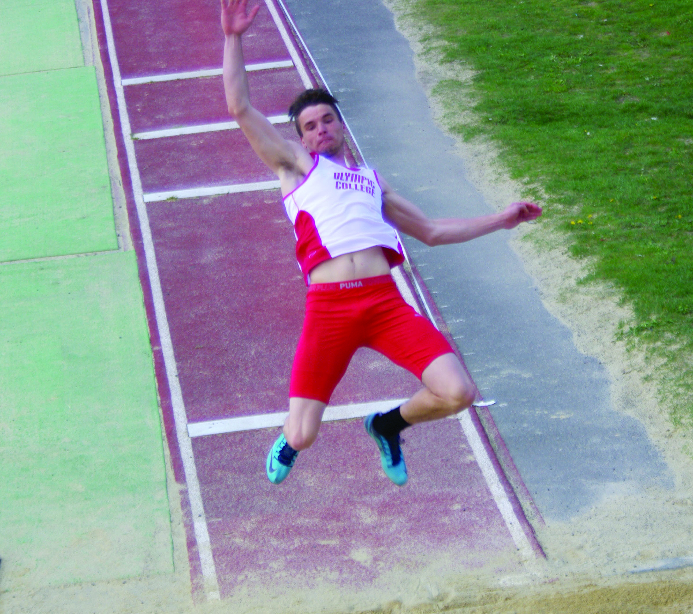 Sequim High School graduate Jayson Brocklesby competes in the long jump as part of the decathlon at the Western Washington University Multi Event meet in Bellingham. Brocklesby is in the lead after the first day. (Dan Dittmer/Olympic College)