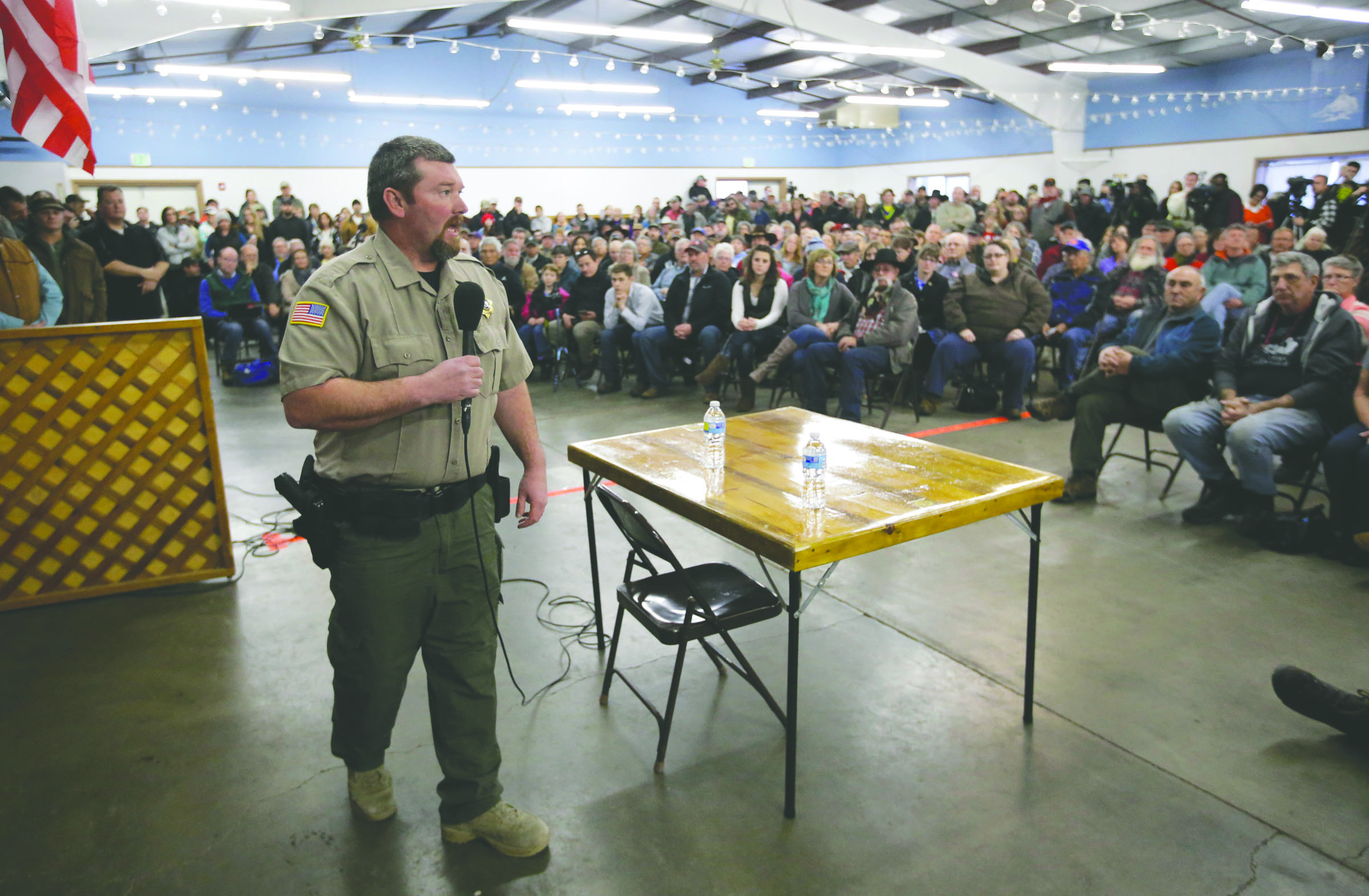 Harney County Sheriff David Ward leads a community meeting at the Harney County fairgrounds in Burns