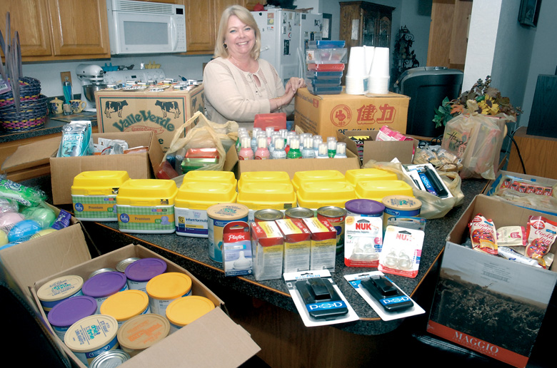Stacey Price of Port Angeles shows off some of the items she purchased as one of the last customers of the now-shuttered Haggen Northwest Fresh supermarket. Price acquired approximately $4