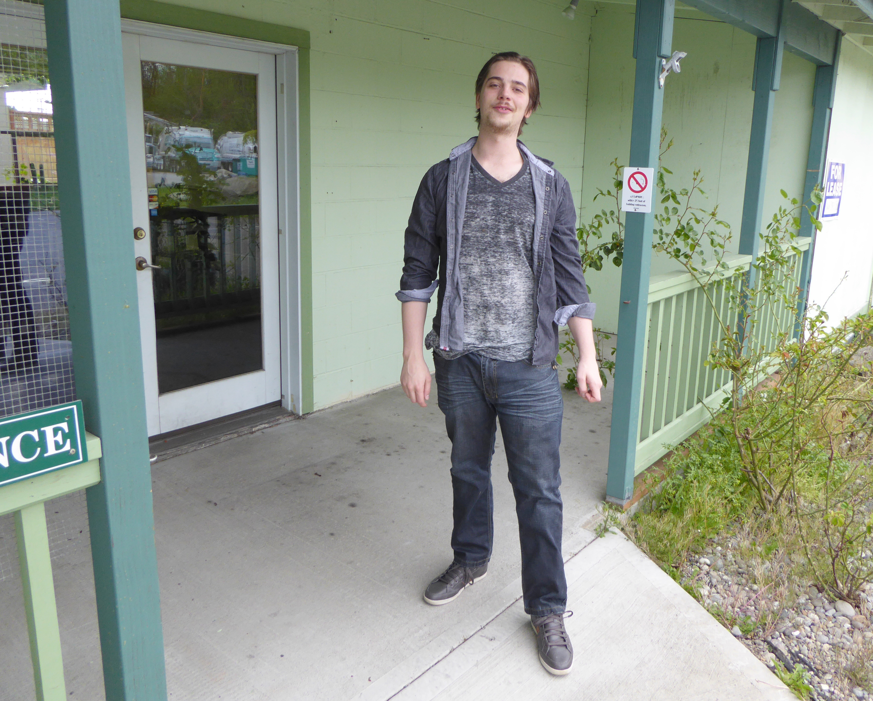 Gracen Hook stands outside the retail building at 2123 W. Sims Way that will be home to his Peninsula Herbal shop. —Photo by Charlie Bermant/Peninsula Daily News ()
