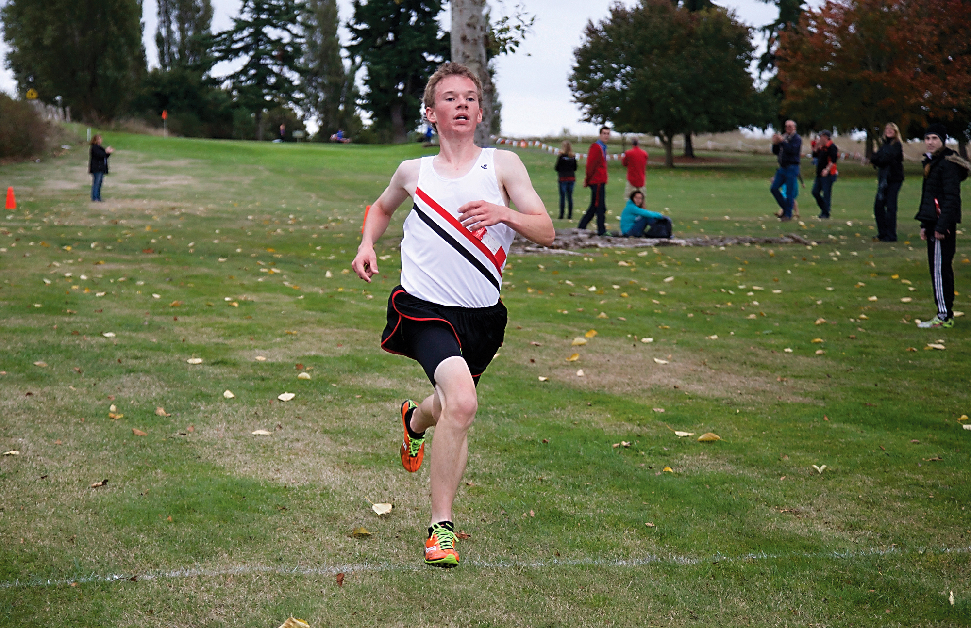 Port Townsend's Ryan Clarke crosses the finish line to win an Olympic League meet at Port Townsend Golf Course in October. Clarke went on to win league
