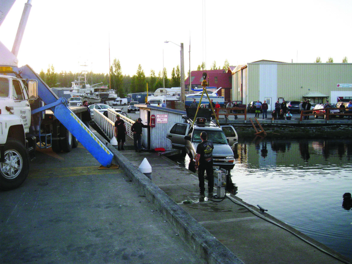 CAR INTO THE WATER — Driving lesson ends in Boat Haven waters in Port