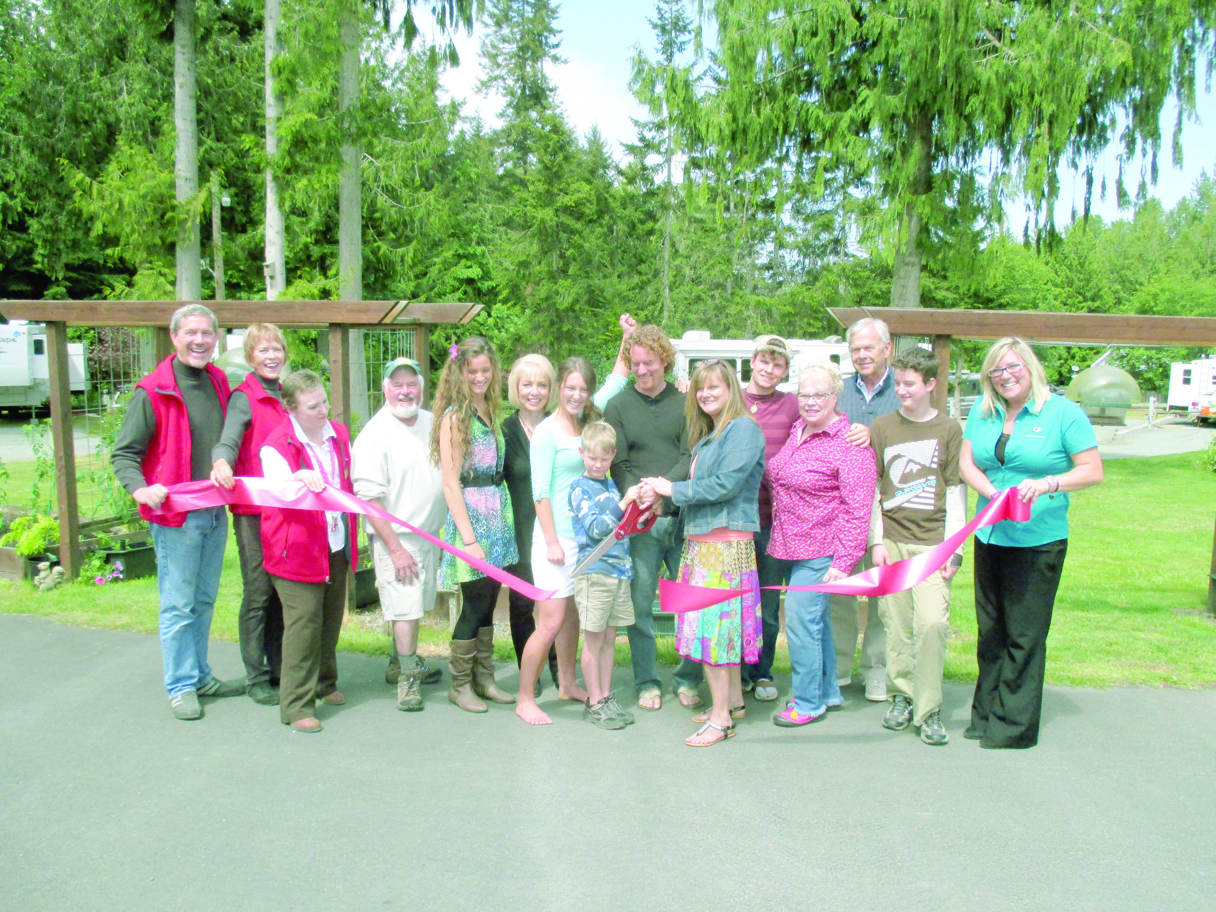 From left at a ribbon-cutting to recognize Elwha Dam RV Parks new ownership are Port Angeles Ambassadors Howard Fisher