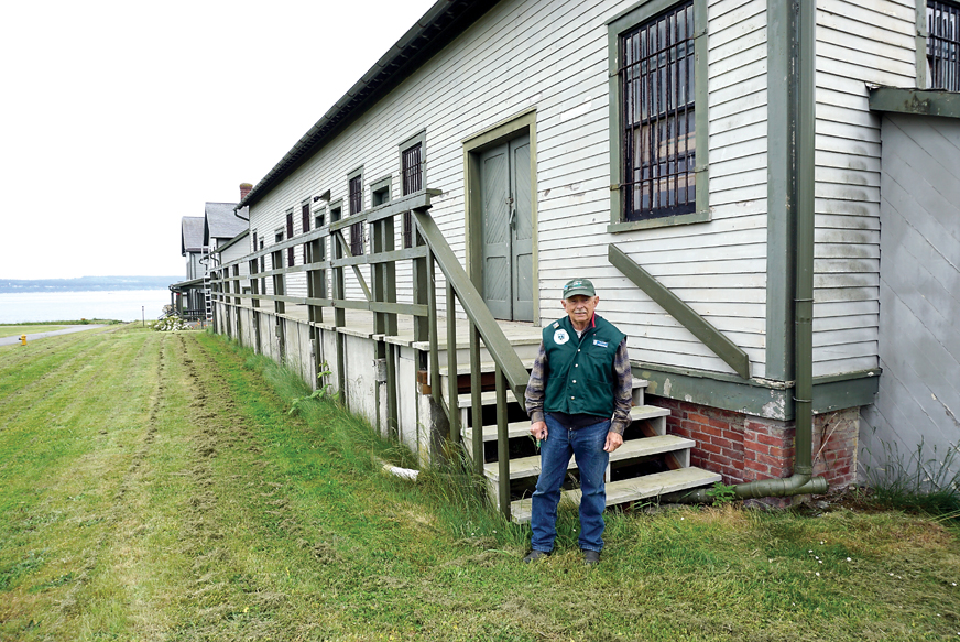 Fort Flagler volunteer Harold Briggs stands outside the park’s woodshop Tuesday. Washington State Parks is investigating the idea of allowing some commercial vendors in some parks. — Charlie Bermant/Peninsula Daily News ()