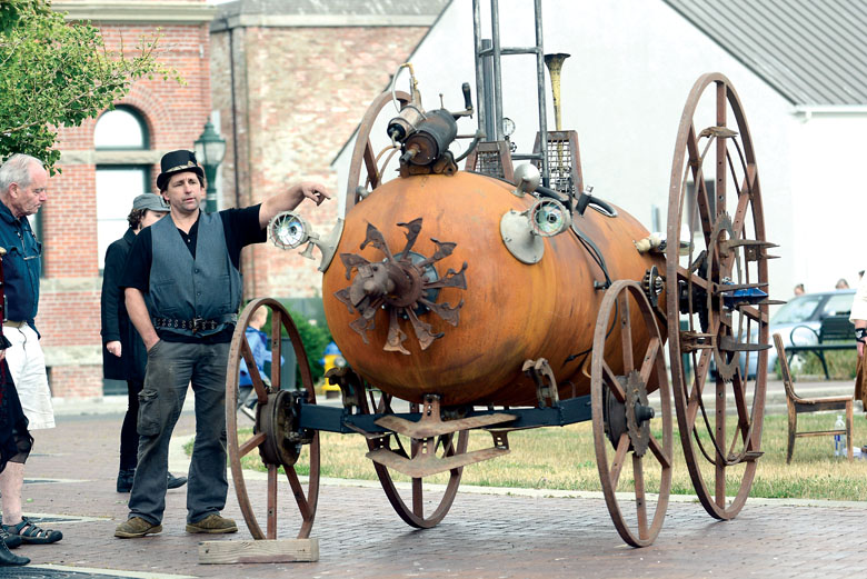 Ray Hammar shows off his “steampunk tank zombie killer” during the Brass Screw Confederacy steampunk festival in Port Townsend on Saturday. (Jesse Major/Peninsula Daily News)