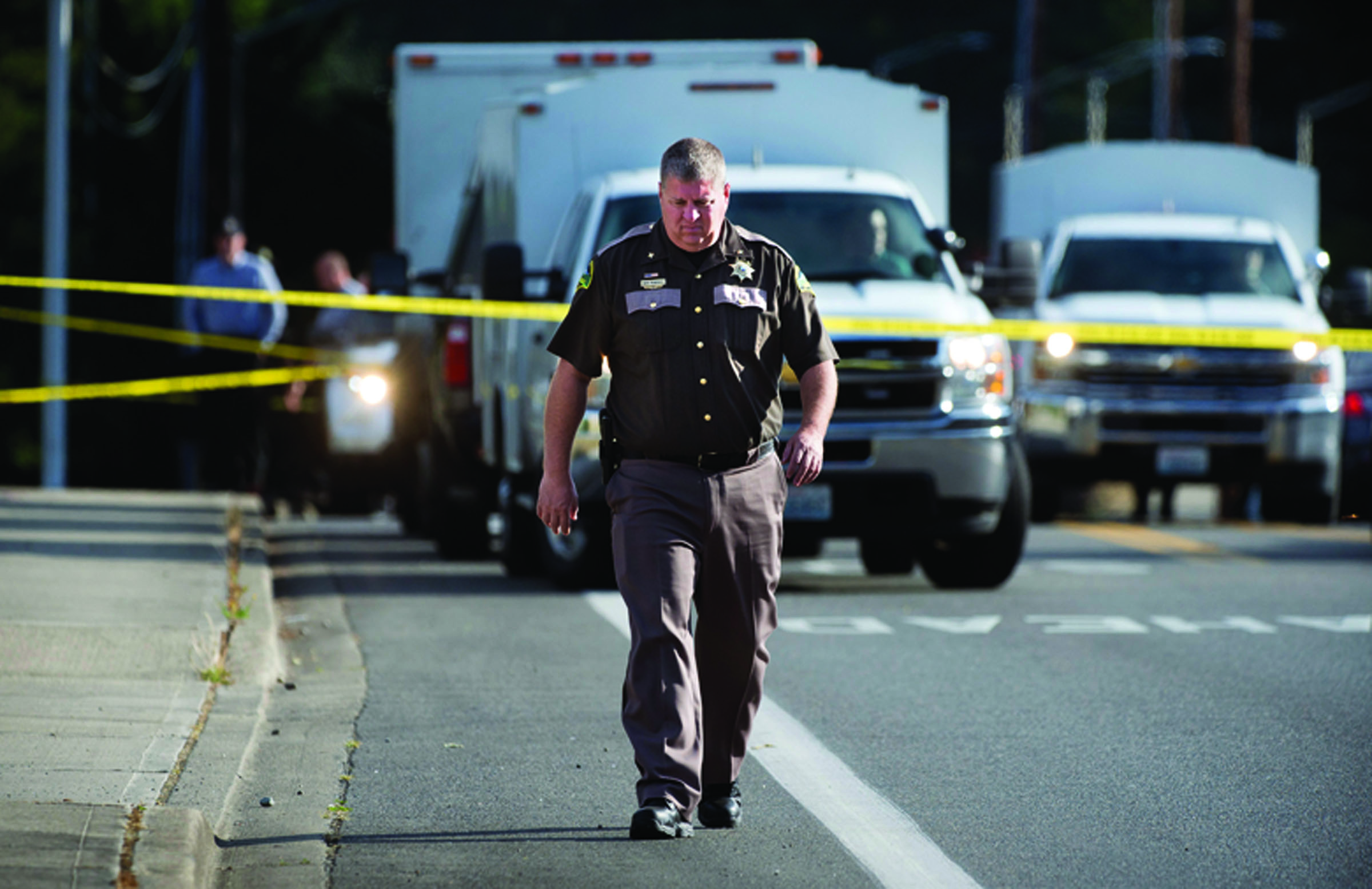 Thurston County sheriff’s detectives investigate an early morning shooting Wednesday near Lacey that left three people dead and one injured