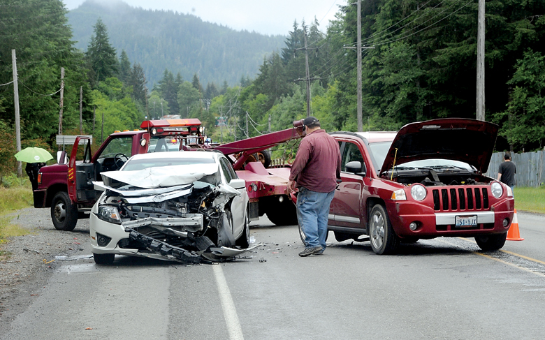 A two-car collision on U.S. Highway 101 in front of West End Motors in Forks sent one person to the hospital Thursday morning. — Lonnie Archibald/for Peninsula Daily News ()