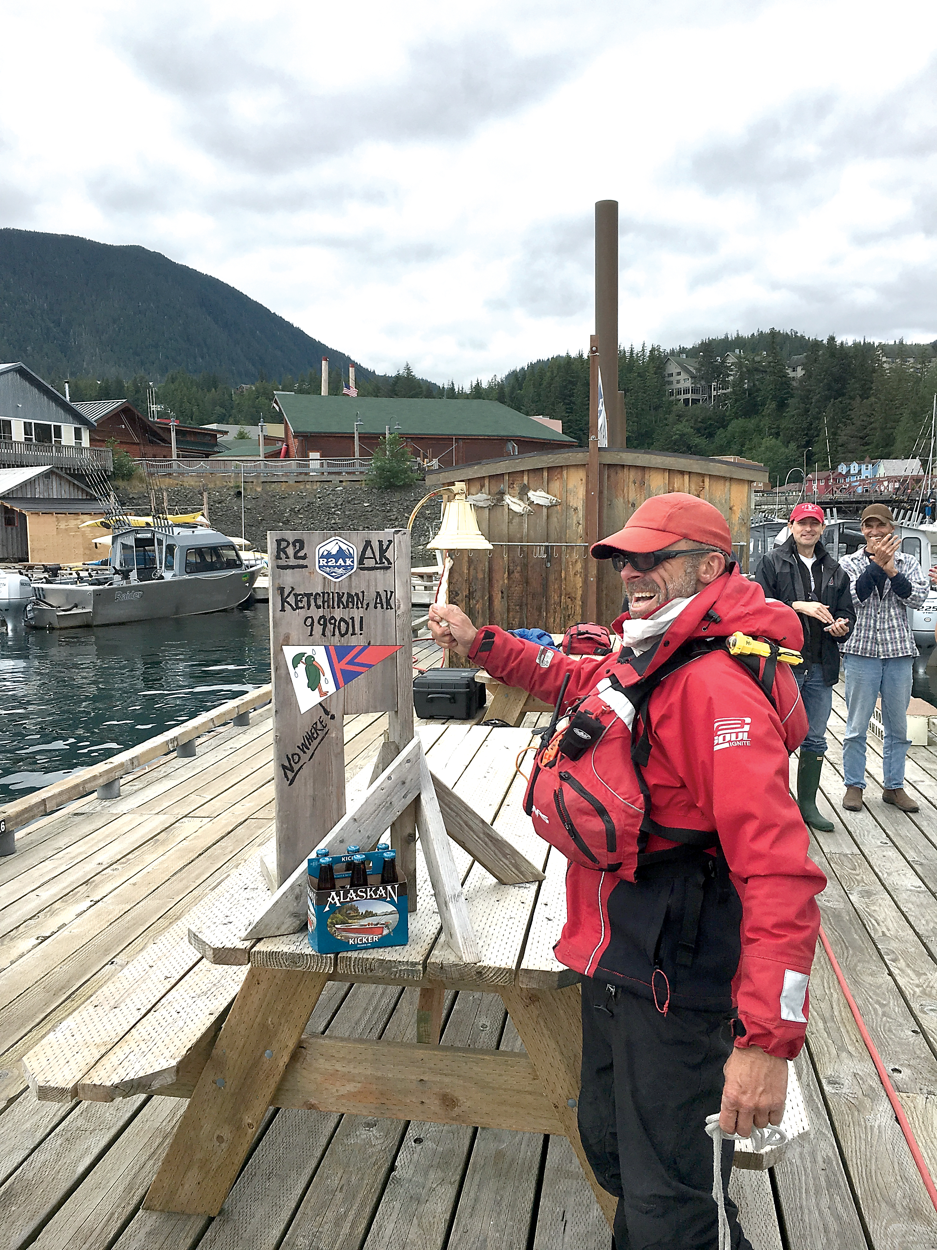 Thomas Nielsen of Team Sea Runners rings the finish bell in Ketchikan after completing the voyage from Port Townsend. — Race to Alaska ()