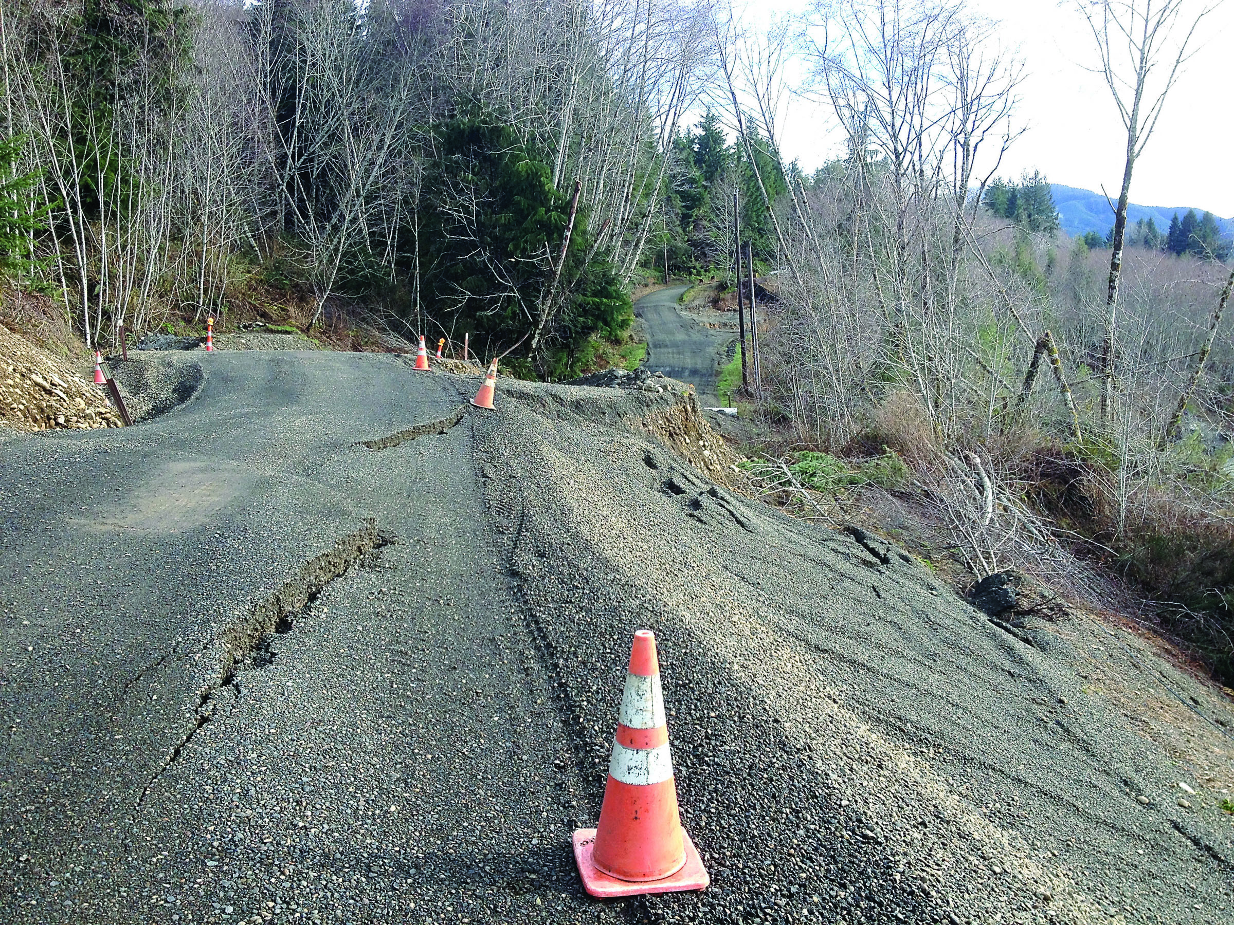 Jefferson County officials are seeking grants to replace a stretch of Undi Road that has been severely damaged by landslides. — Monte Reinders ()