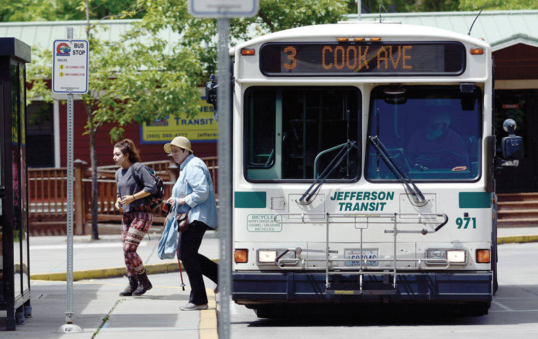 Passengers get off a Jefferson Transit bus at the Haines Park and Ride in Port Townsend on Wednesday. — Jesse Major/Peninsula Daily News ()