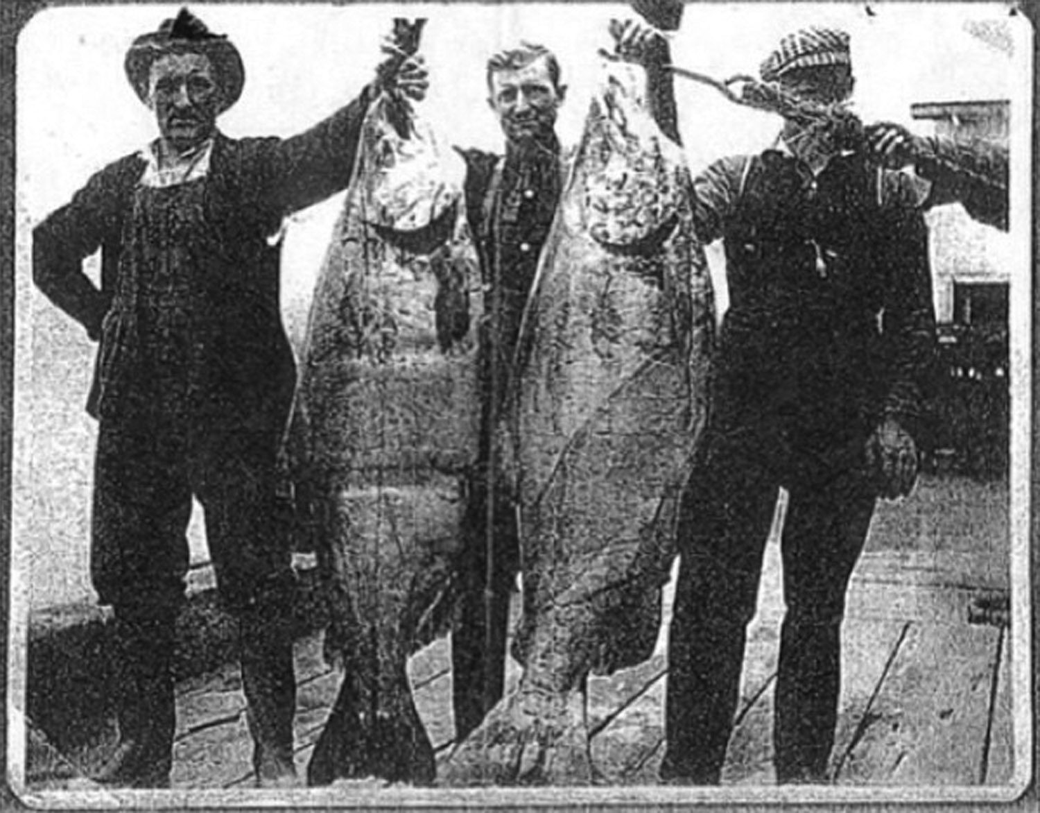 This undated photograph shows two unidentified fishermen in Astoria