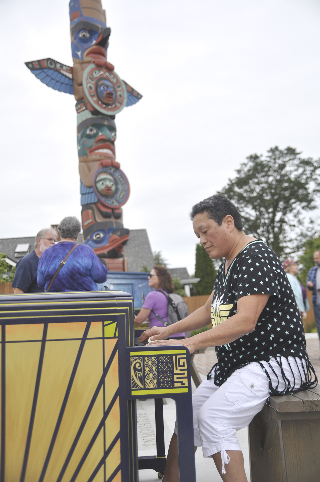 Liz Tomisato of Sequim tickles the ivories at the Sequim Civic Center at the July First Friday Art Walk. Three pianos will remain on Sequim's streets through Saturday. (Michael Dashiell/Olympic Peninsula News Group)