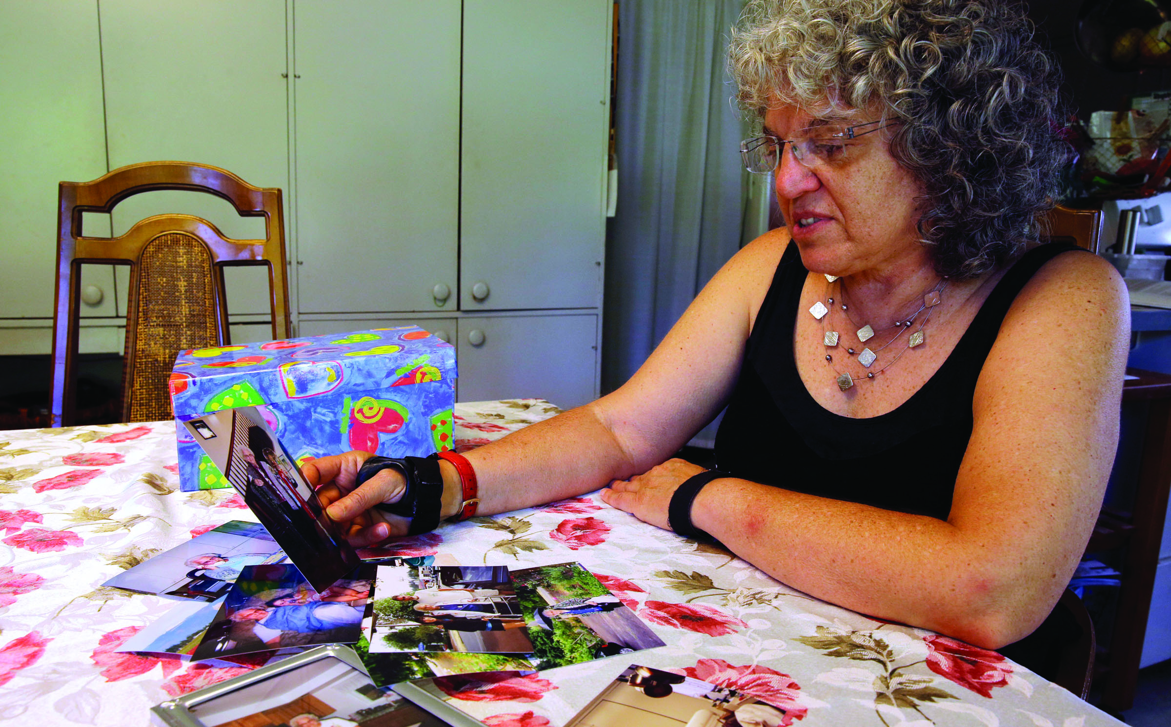 Roslyn Duffy looks through photos of her late mother
