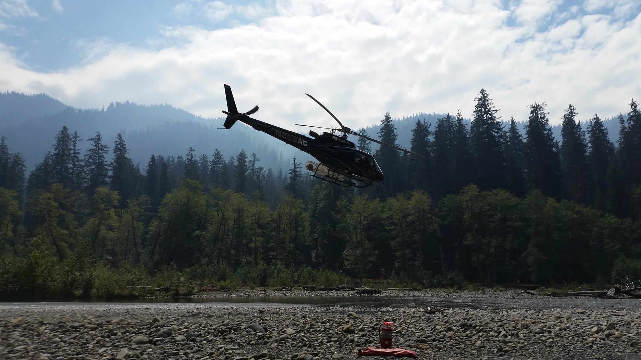 A Type 3 firefighting helicopter departs for a mission near the Paradise Fire perimeter. Olympic National Park