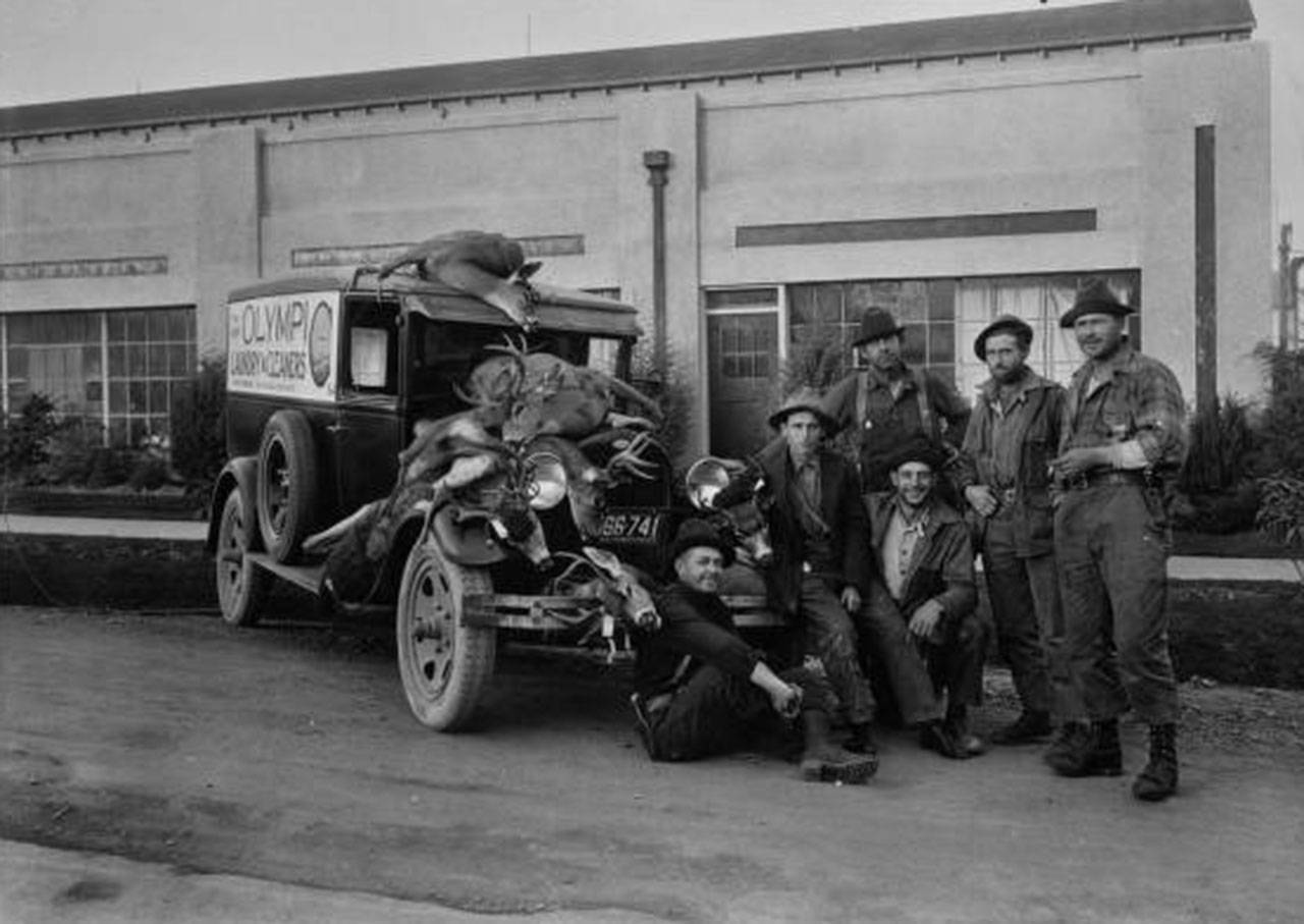 Consuelo White said this photo was from an article she published in the Genealogical Society’s newsletter in an unknown year. Charlie White is the last man on the left. The truck is in front of the Olympic Laundry. Others in photo, which was taken in 1929, from left, are Dewey Schell, Jack Ferris, Ernie McKnight, Al McKnight and Dave Moffet. (Malcolm White)