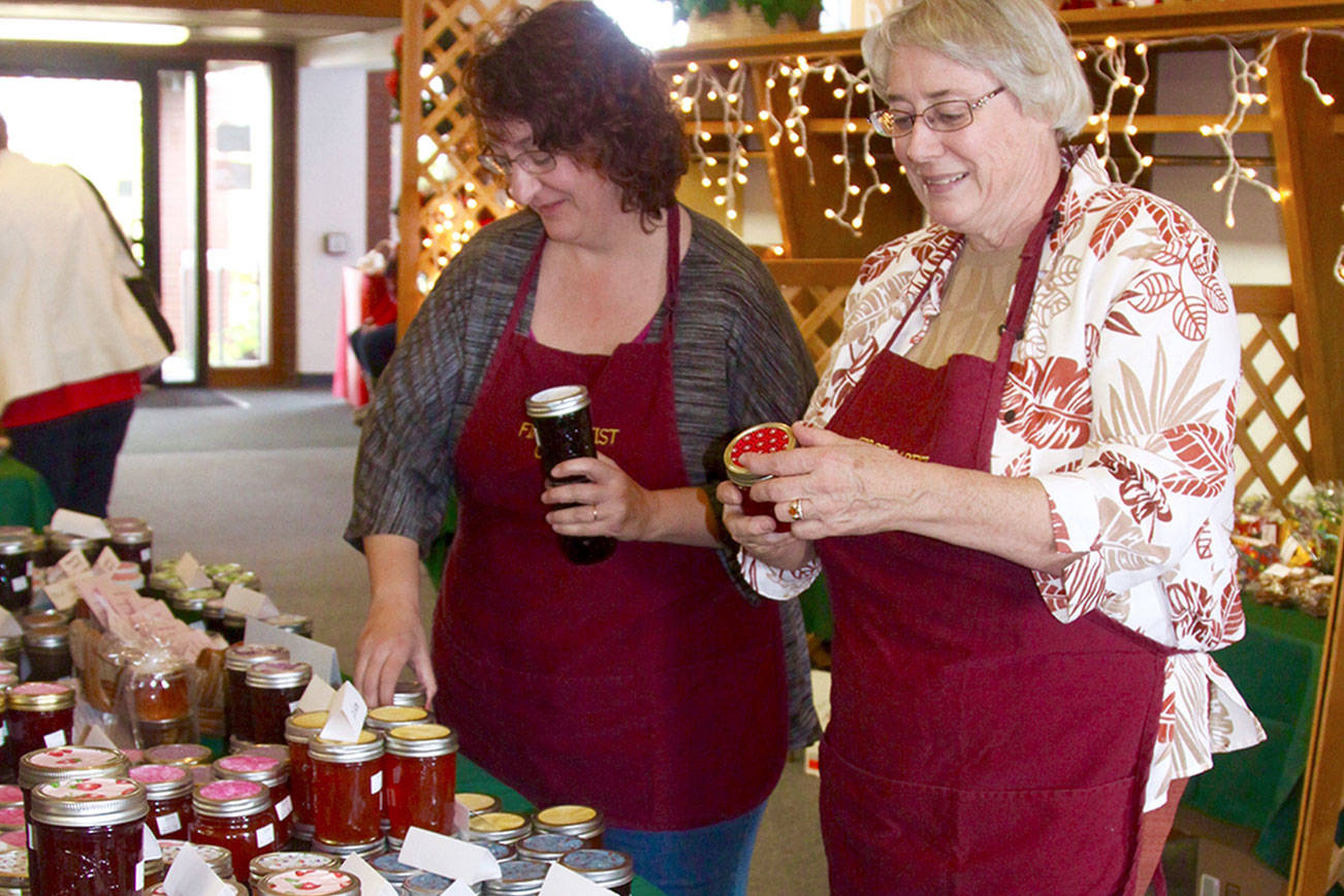 The Christmas Bizarre season is upon us now. Seven organizations have their bizarres this first weekend in November. Pictured here is preparation for the bizarre at the First Baptist Church in 2016. Kim Luker (l) and Robin Sweeney look over the many jars of handmade jams and jellies especially made for the public sale. dlogan
