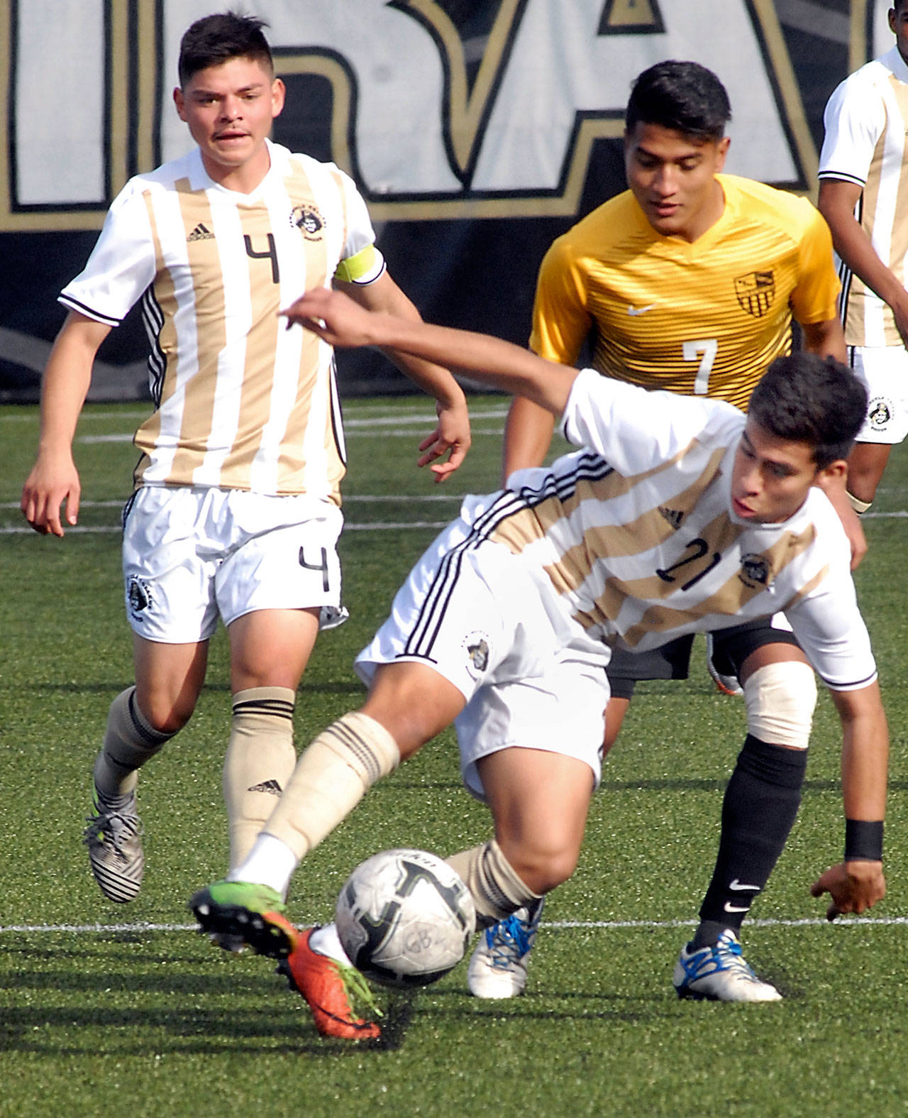 Keith Thorpe/Peninsula Daily News                                Peninsula’s Michael Benito, front, steals the ball from Walla Walla’s Victor Sanchez, right, as Benito’s teammate Sergio Gonzalez Reyes follows behind during their NWAC first round playoff game on Wednesday at the Wally Sigmar Sports Complex in Port Angeles.