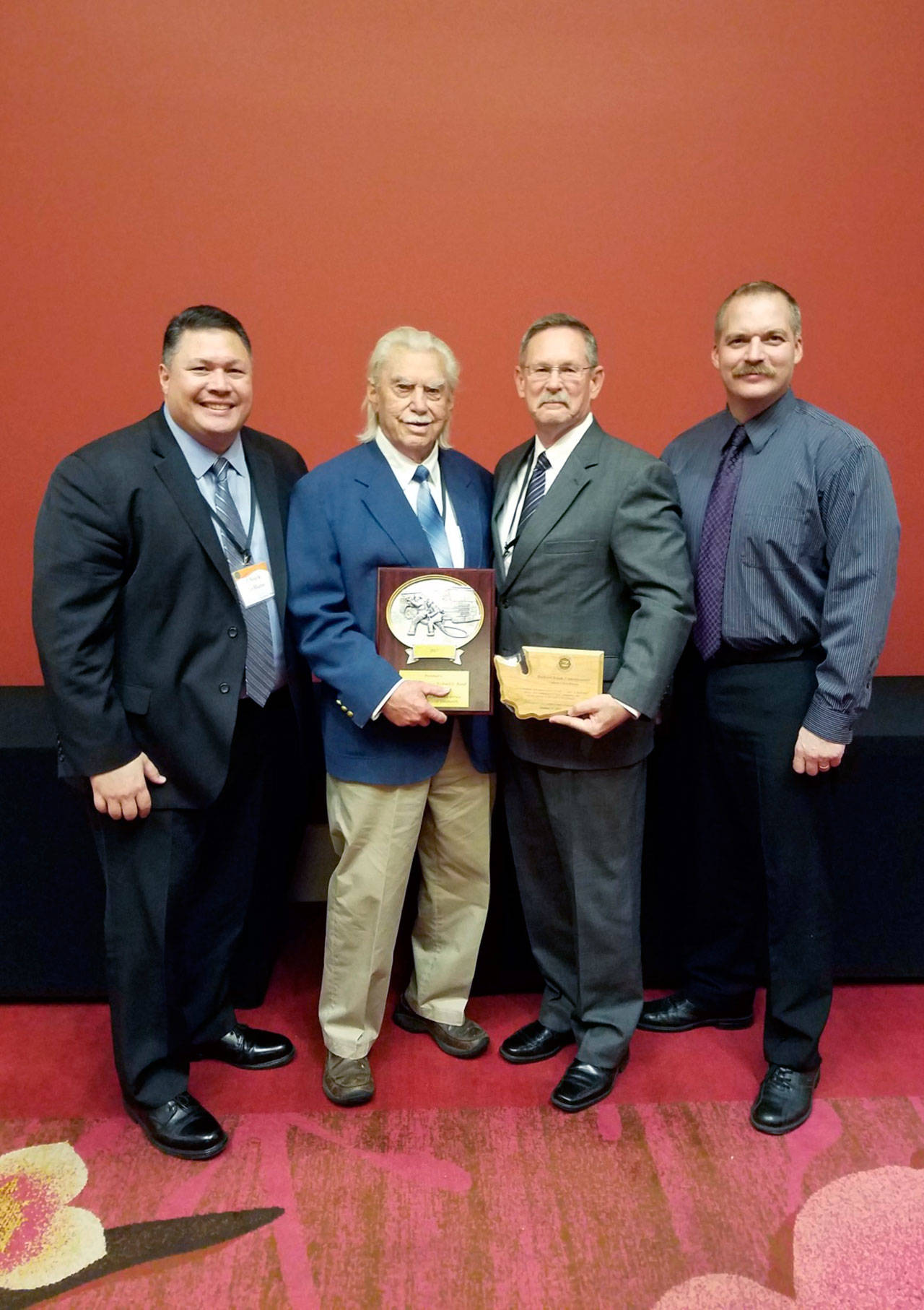 Pictured from left are State Fire Marshal Charles LeBlanc, Clallam County Fire District No. 2 Commissioner Richard Ruud, Fire Chief Sam Phillips and Deputy Fire Chief Jake Patterson. (Clallam County Fire District No. 2)
