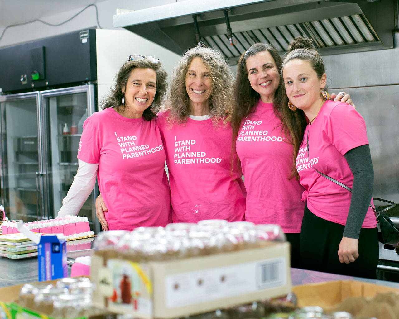 Volunteers Jude Ruben, Abby Kaufman, Jeanne Simmons and Callay Boire at the Oct. 21 Planned Parenthood centennial celebration in Port Townsend. (Melissa Jentzsch)