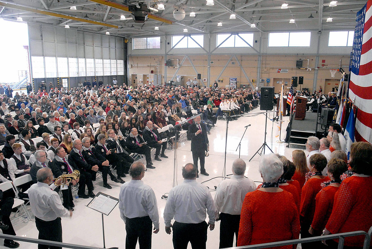 People gather in the hangar at U.S. Coast Guard Air Station/Sector Field Office Port Angeles on Ediz Hook for the 2016 Veterans Day ceremony. (Keith Thorpe/Peninsula Daily News)