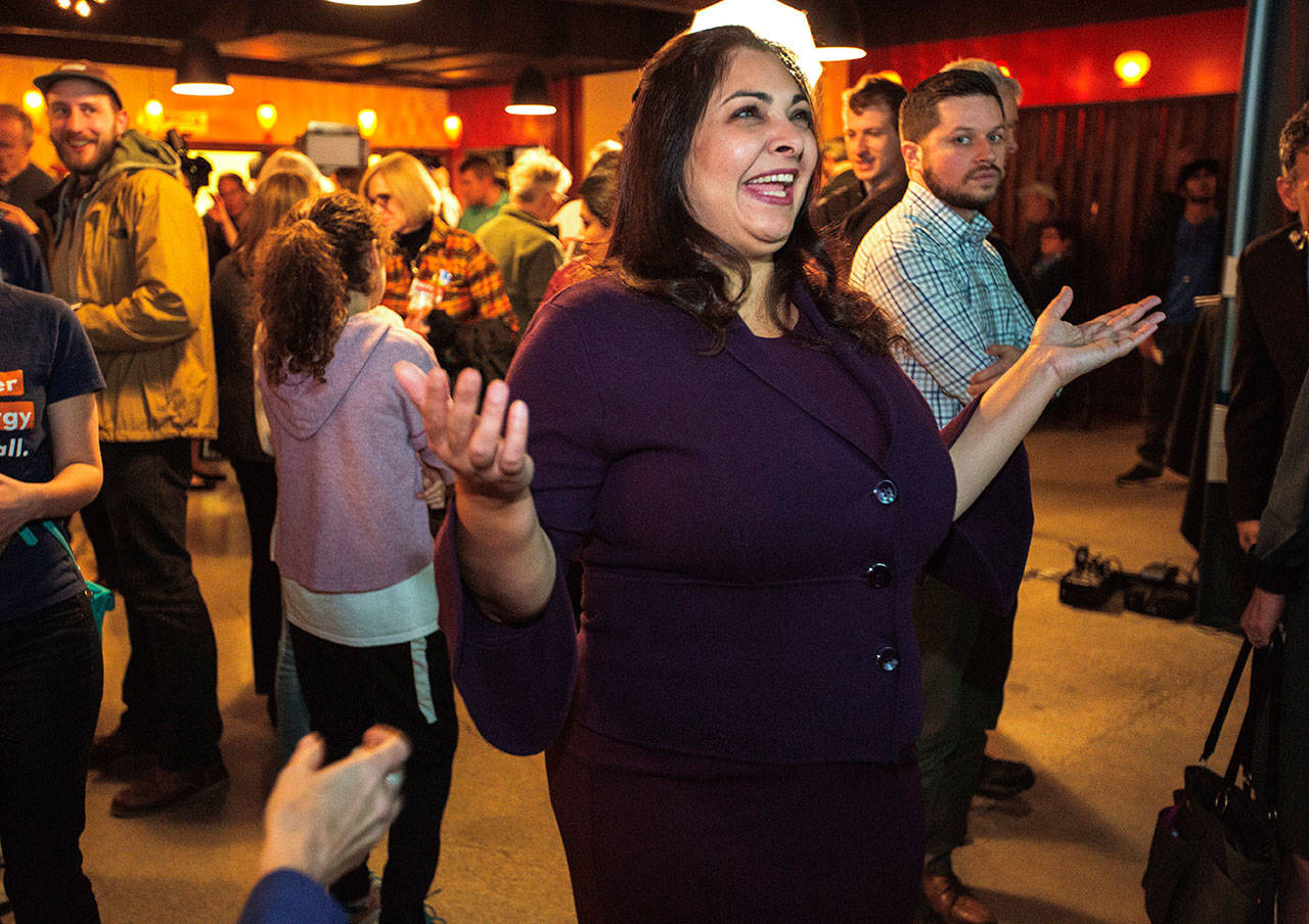 Democrat Manka Dhingra, running for state senator for the 45th District, greets supporters in Woodinville on Tuesday. (Mike Siegel/The Seattle Times via AP)